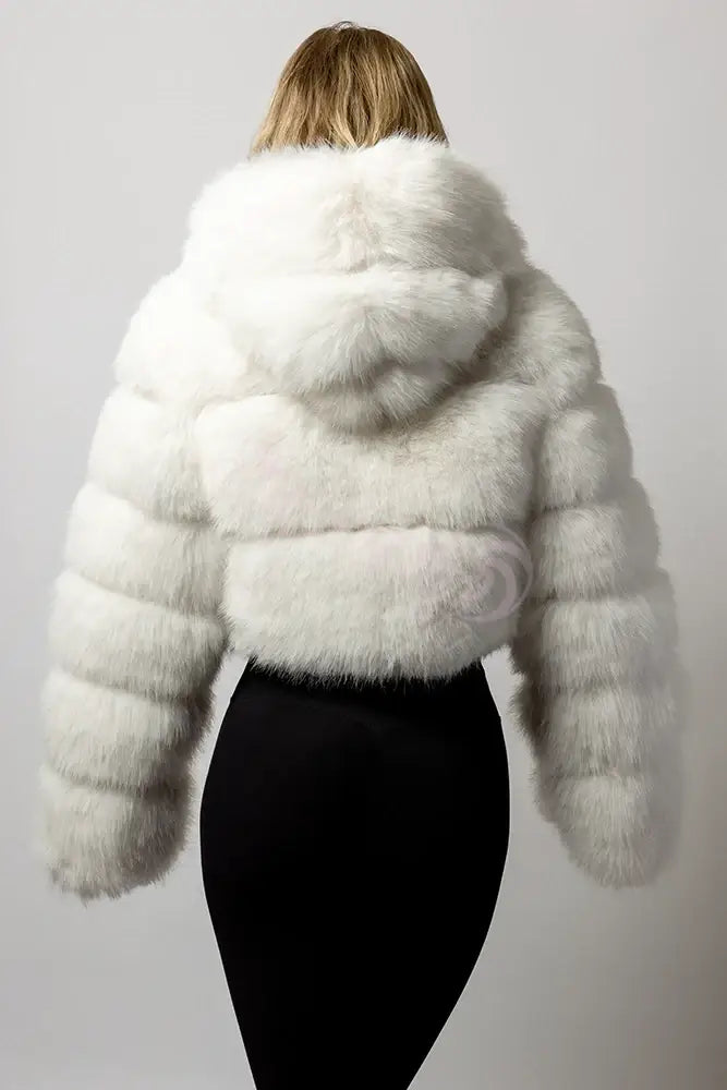A blonde model wearing the SugarFur Frost White LED Coat from the back showing the hood laying flat