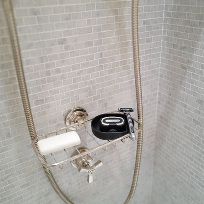 A Razor Rinser in the shower, showing that you can use the Razor Rinser no matter where or how you shave.