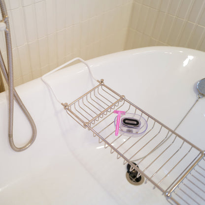 A Razor Rinser in the bathtub, showing you can use the Razor Rinser no matter where or how you shave. 