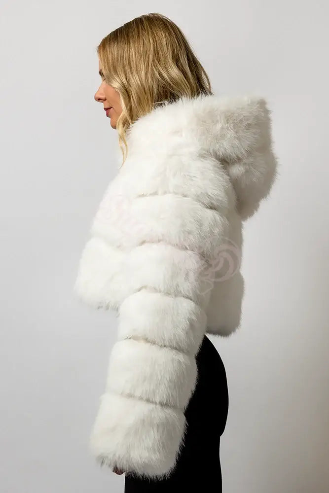 Blonde model wearing a SugarFur Frost White LED Coat coat from the side showing fluffy texture of coat